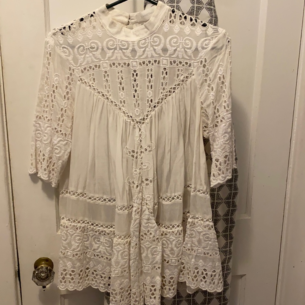Large white blouse with bottons on back